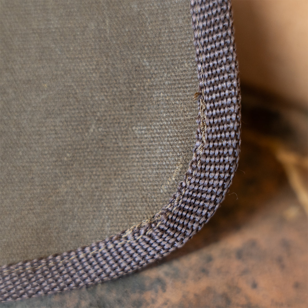 Corner stitching detail on Clearance: Carrying Sling for Saws and Axes, showing reinforced edges for durability in tool transport.