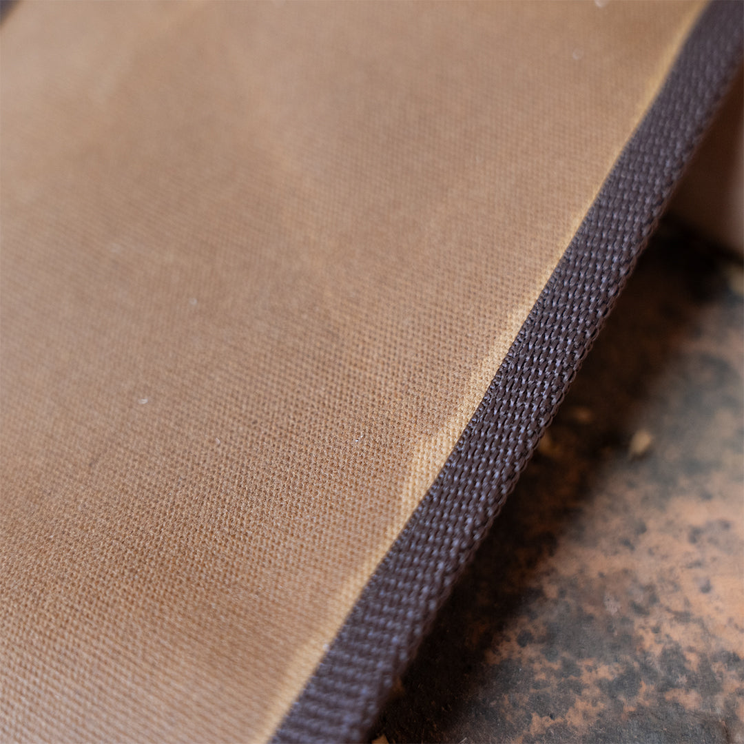 Canvas and trim detail on Clearance: Carrying Sling for Saws and Axes, highlighting rugged material for axe and saw carrying.