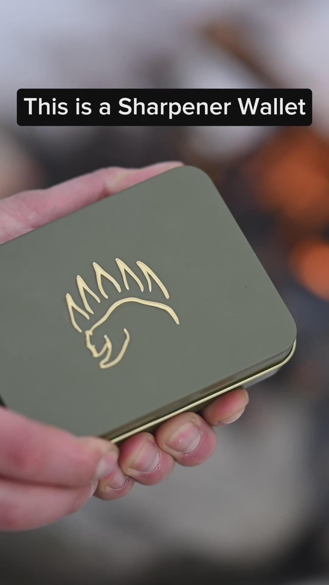 Green metal case with bear claw logo labeled 'This is a Sharpener Wallet,' showcasing premium packaging for the Field Sharpener Wallets.