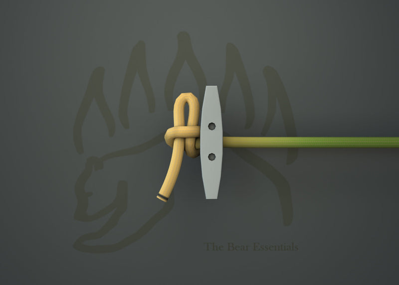 Slip knot tied around a peg with rope, demonstrating knot-tying basics.