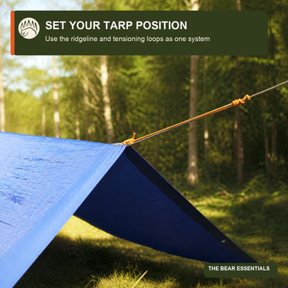 Tarp shelter pitched with the Tarp Ridgeline Kit in a wooded campsite