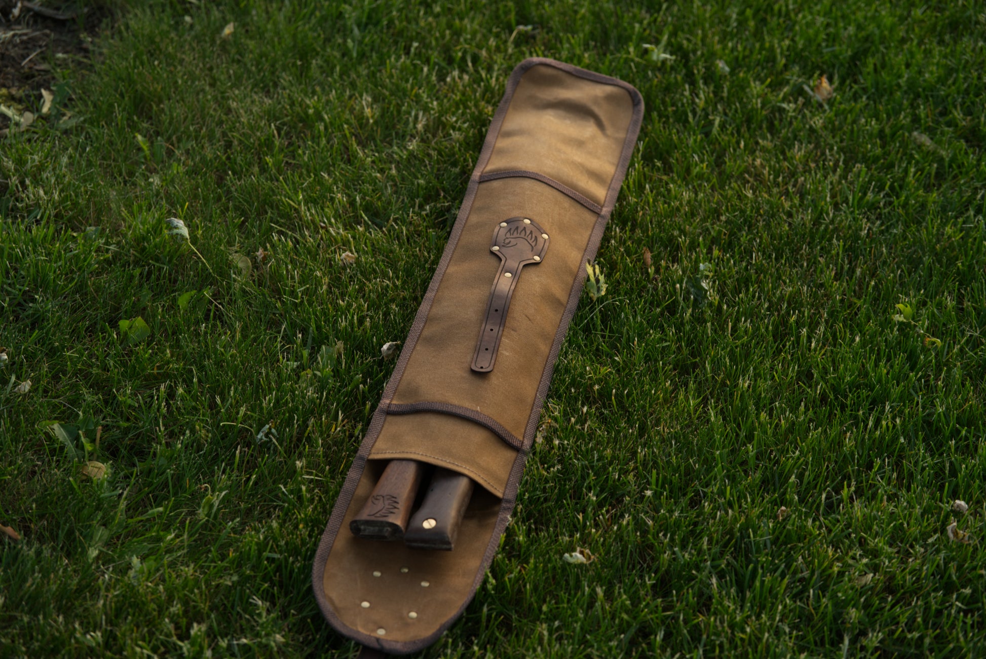 Waxed canvas carrying case for saw and axe
